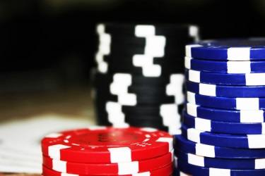 Stack of Poker Chips Representing Gambling vs Investing