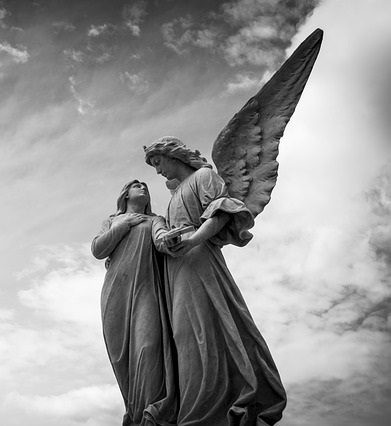 Impact Investing Represented by Angel Statue with Woman